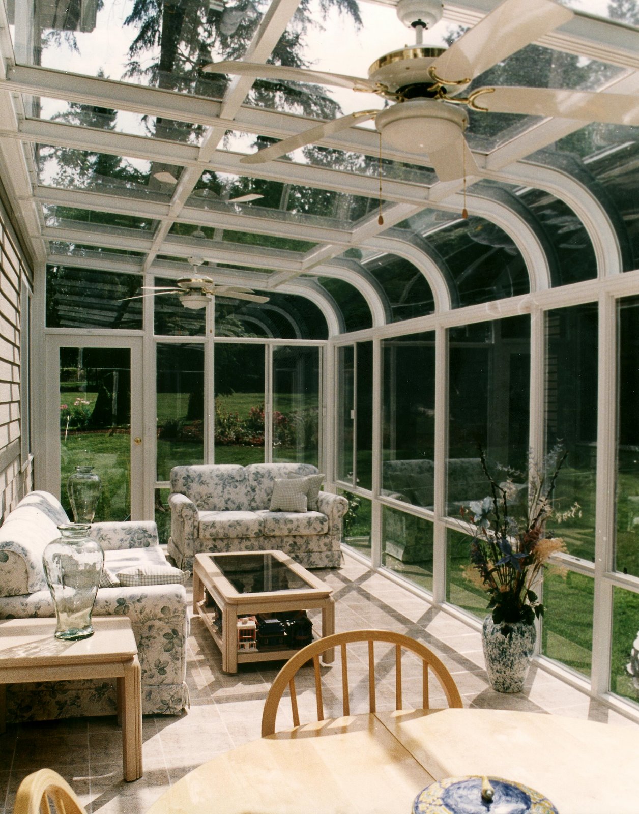 Sunroom with glass roof and glass walls