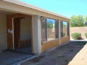 Enclosure under existing patio roof can be an Arizona room, sunroom and any activity room